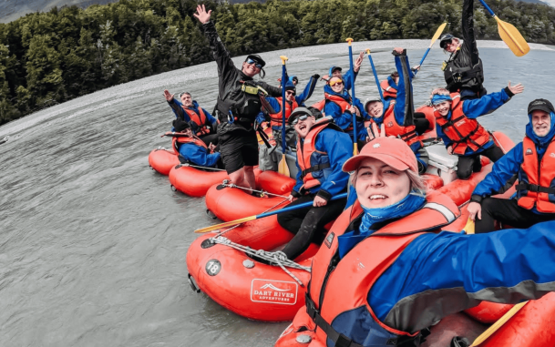 Funyak group and guides smiling in their funyaks on the river
